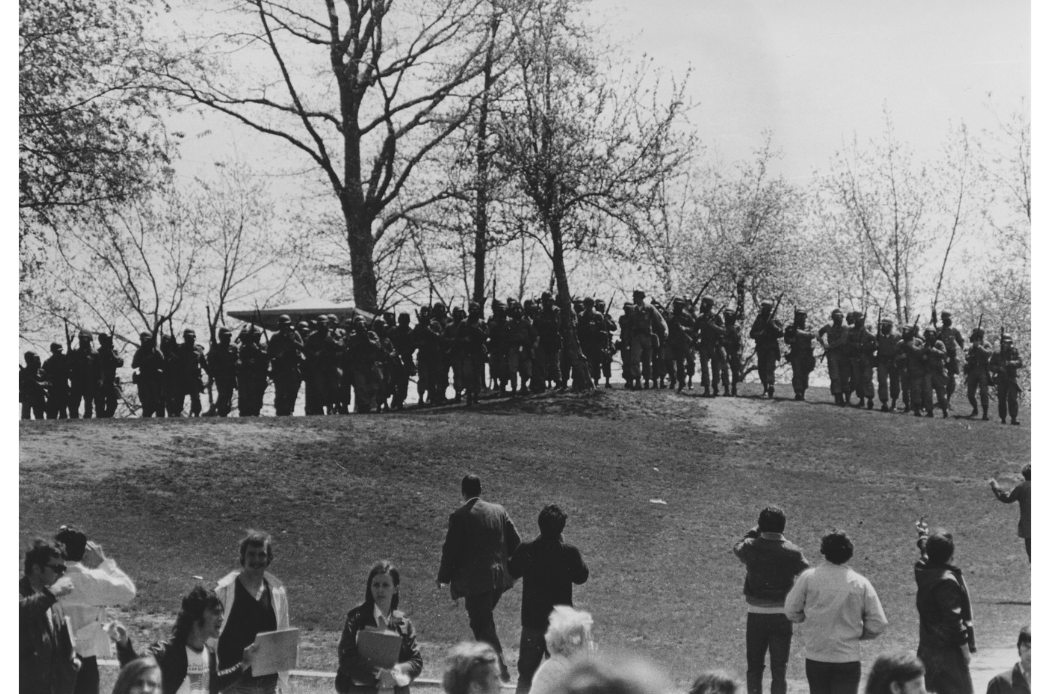 Row of National Guard personnel at the crest of hill near the Pagoda sculpture Preview