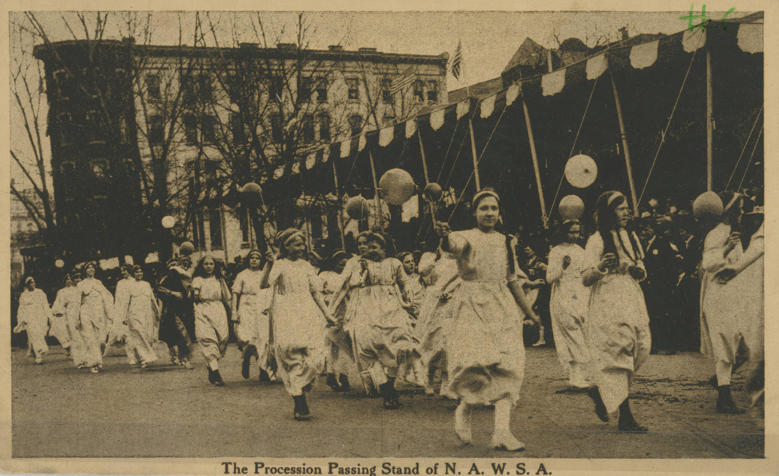 Black and white photograph of girls marching in parade